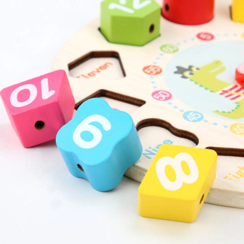 jouet-en-bois-horloge-manchot-details-pastels