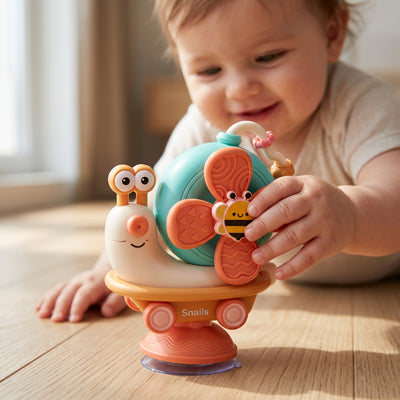 jouet-evolutif-escargot-orange-bebe-touche